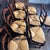 Classic set of eight immaculate French Louis XV-style walnut dining chairs, elegantly crafted with shaped ladder backs,...