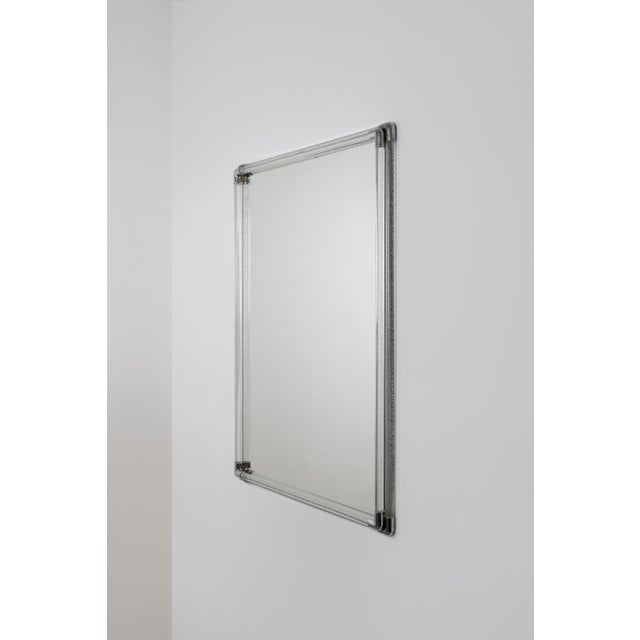 An elegant mirror by the renowned Italian manufacturer Seguso, created in the 1970s. The frame is crafted from two...
