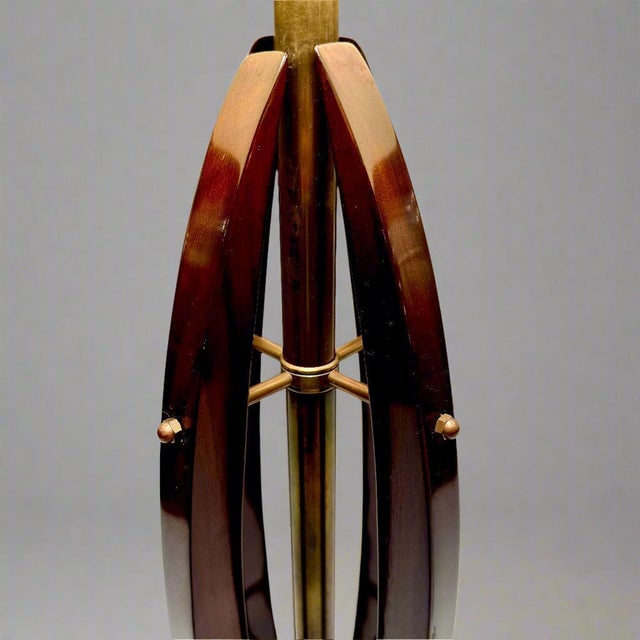 Pair of architectural table lamps in the form of three beautifully arched lacquered hardwood pieces. Each piece is joined...