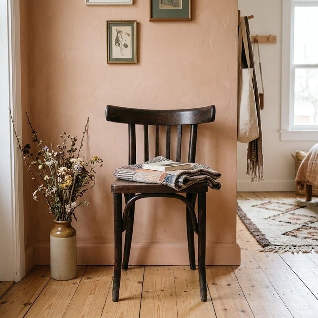 A 1930s bentwood chair by Thonet, crafted from steam-bent beechwood in the company’s signature curved silhouette....