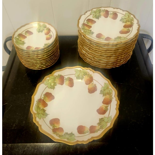 exquisite 25 piece set of Limoges porcelain from the 1890s, produced by Blakeman and Henderson, Art Nouveau scalloped gold...