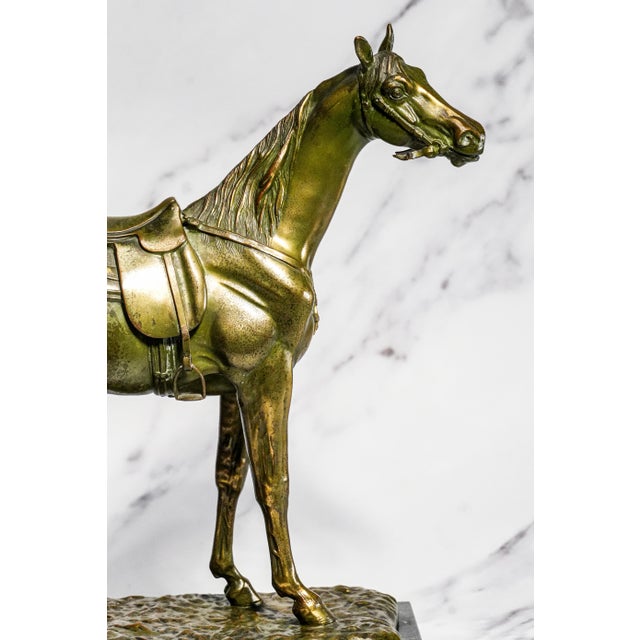 A striking example of early 20th-century equestrian decor, this large antique cast metal statue, dating to circa 1930s,...