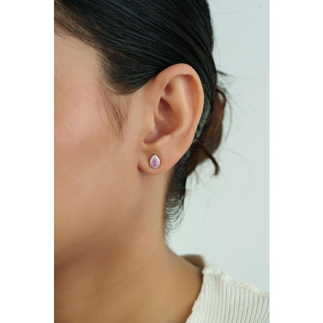 These elegant stud earrings feature 0.48 carats of natural pear-cut pink sapphires set in 18k white gold. Each sapphire...