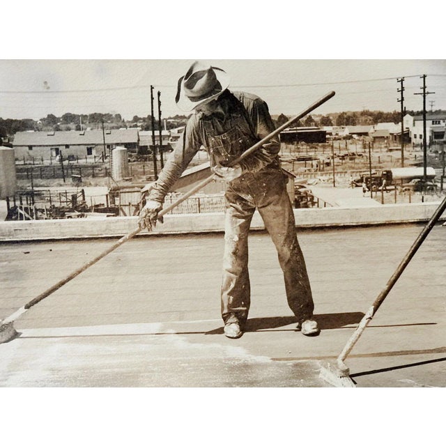 Vintage circa 1950's photograph on paper of man working on roof. Hard working man in overalls tarringa roof, industrial...