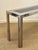Elegant and large console table in chromed metal and dark blue glass, produced by Liwan's Rome circa 1970s. Good...