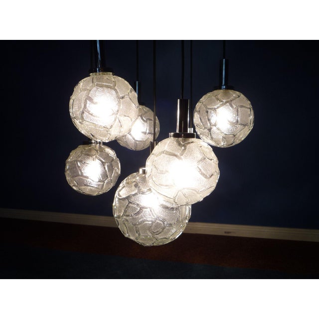 Wonderful Doria hanging lamp from the end of the 60s. 7 ice glass balls make a very nice light. Fully functional. Very...
