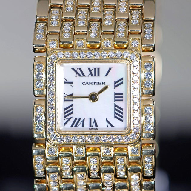 Cartier Panthère Ruban ref. WG3009TA in 18K yellow gold, circa 2000, featuring a mother-of-pearl Roman numeral dial,...