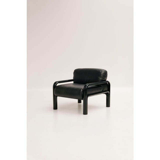 Model 54 armchairs designed by Gae Aulenti and produced by Knoll International. All-black models with a metal frame and...