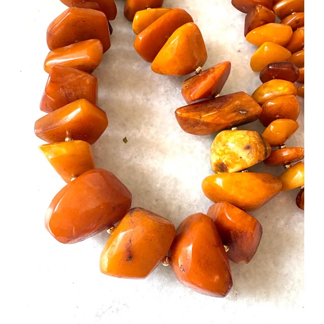 Gorgeous, long vintage butterscotch Amber necklace with gold tone spacers- restrung.