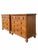 A pair of solid pine chests of drawers by The Milling Road Division of Baker Furniture. Each dresser has five dovetail...