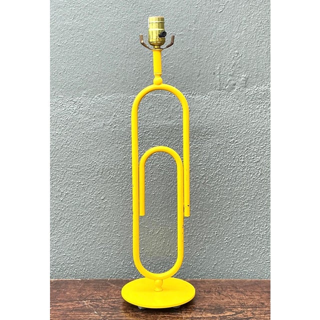 A delightful blend of functional lighting and sculptural design, this vintage paperclip table lamp captures the playful...