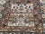 The color is balance, the ivory center in opposite of the darker border and design. The same way the design is balance, a...