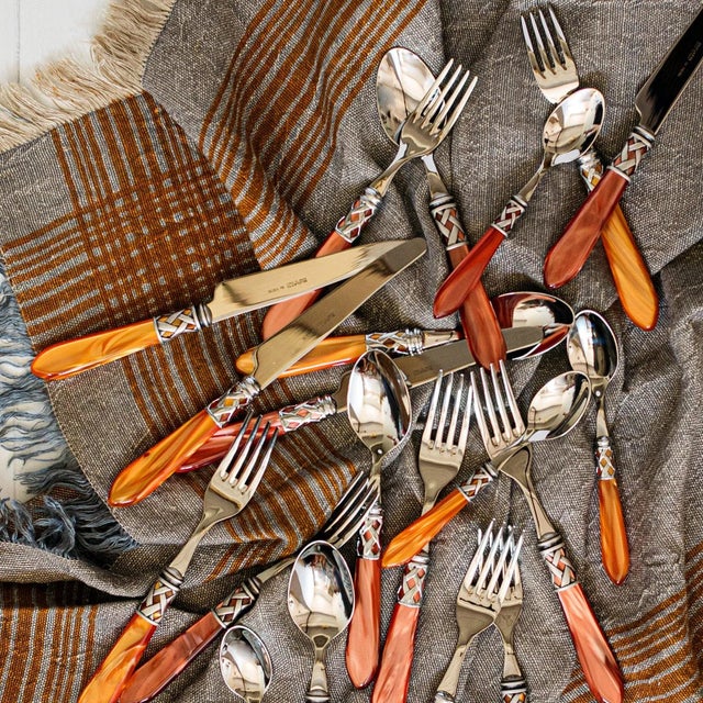 The Aladdin Antique Five-Piece Place Setting features elegant pearlized handles with the strength of high-grade acrylic...