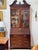 An early George III period mahogany bureau bookcase, the swan neck pediment with carved rosette terminals and a blind-...