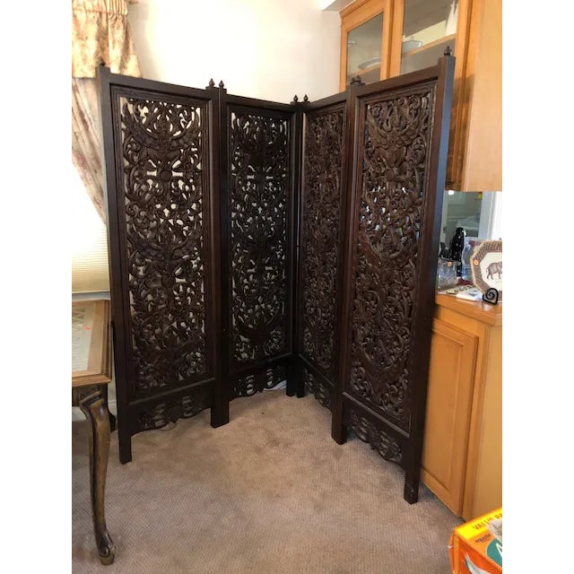 This stunning four-panel Thai Teak wood Hand carved mid-century room divider is a true one of a kind. Each panel depicts...
