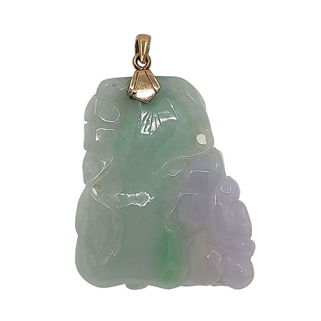 Estate carved lavender & green jade 18K pendant. This estate pendant features a beautifully carved jade with both lavender...