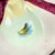 A French porcelain oyster plate, circa 1890 – 1910. Six shell shaped oyster wells with multicolored, hand painted ‘eyes’...