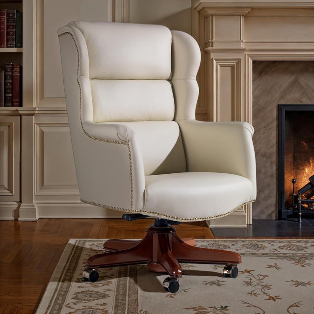 Elegant presidential armchair with leather coating. The production of each original article of the Marzorati collections...