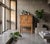 Small cabinet in solid oak with a Brutalist expression, featuring carved details and solid brass handles. The design...
