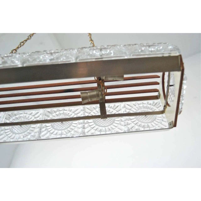 Scandinavian pendant, glass attributed to Orrefors, Sweden, circa 1960s. Glass, teak and metal. Four European candelabra...