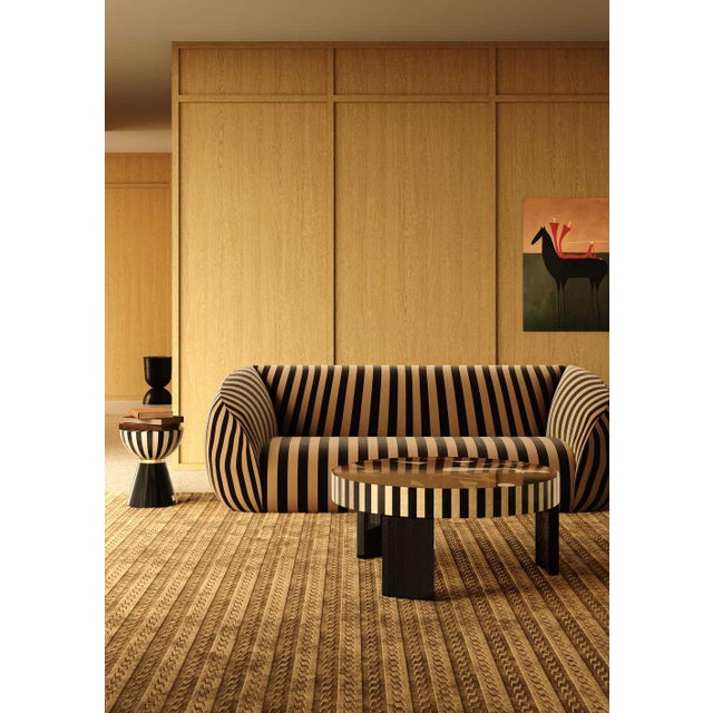 The Gaya Sofa Stripes features a contemporary design with mid-century modern appeal, making it a striking addition to...