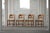 A beautiful and sculptural set of 10 oak dining chairs designed by Henning (Henry) Kjærnulf for Nyrup Møbelfabrik,...