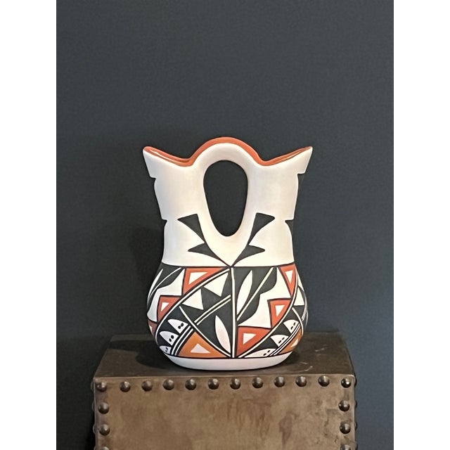 This exquisite 8-inch tall Acoma Pueblo wedding vase represents a stunning fusion of traditional Native American...