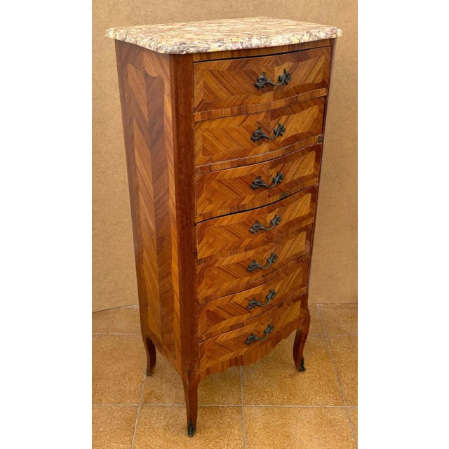 Super quality French Louis XV Style marquetry tall chest of seven drawers with original marble top and original ormolu...