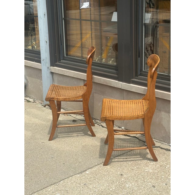 Pair of highly figured curly maple klismos style side chairs, stamped at the bottom by well known New York cabinet maker...