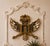 A striking Spanish Colonial giltwood heraldic-form mirror frame dating to the late 18th or early 19th century. The...