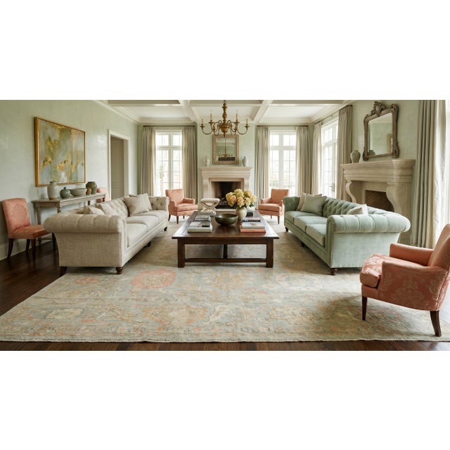 Elevate your space with this hand-knotted Modern Oushak wool rug, featuring a sophisticated palette of muted ivory, soft...