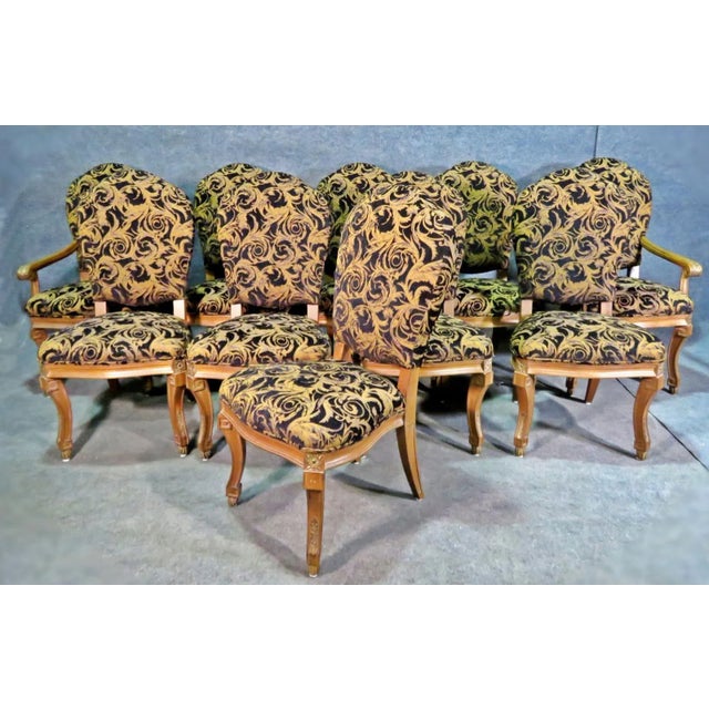 Upholstered seat and back. 2 chairs have arms. Chairs with arms measure 43" H x 24 5/8" W x 22" D. Seat height 20 1/4"....