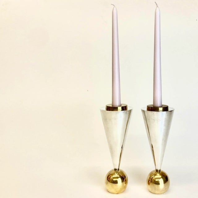 This pair of candle holders is rare. Produced in the 1980s postmodern era, their classic geometric features and gleaming...