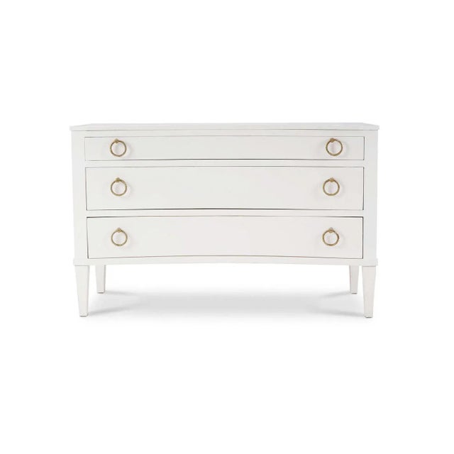 Made of mahogany and finished in a lightly distressed architectural white painted finish, this commode showcases the...