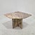 This elegant sculptural side table is crafted entirely from solid marble and originates from Italy. The table features a...