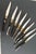 Unusual set of eight vintage Laguiole steak knives with stainless steel blades, brass bolsters and natural horn curved...