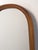 An elegant Swedish Modern wall mirror crafted in teak, distinguished by its tall, slender proportions and softly rounded...