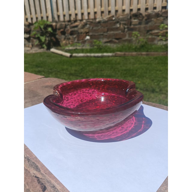 This radiant Murano-attributed glass bowl features rich cranberry red glass embedded with shimmering gold aventurine...
