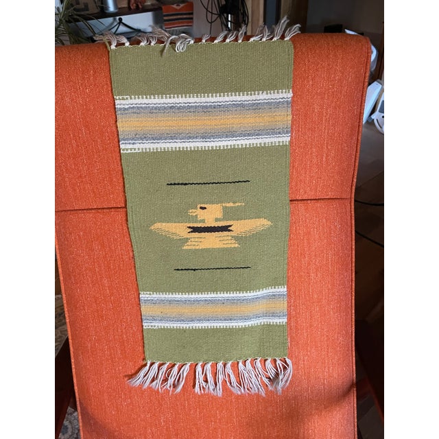 Vintage New Mexican wool Chimayo tapete weaving, lime green background, central image is yellow, black, white stripes....