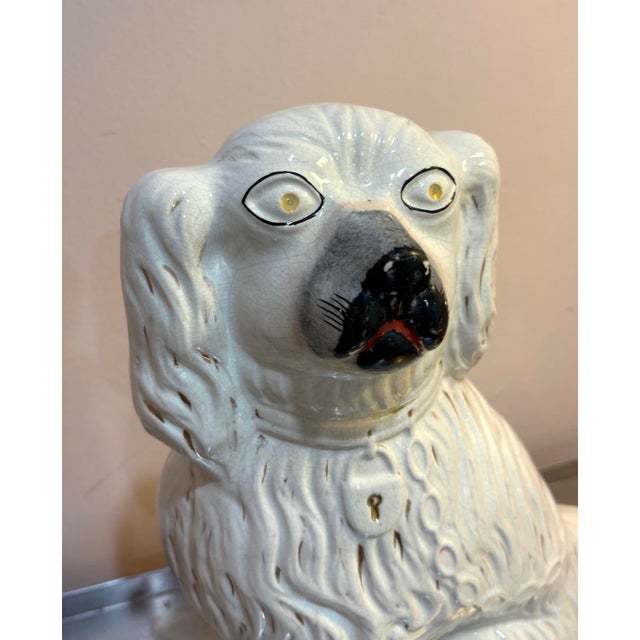 Antique LARGE white ceramic Staffordshire dog sculpture. Some slight fading of color finish in a couple spots as shown....