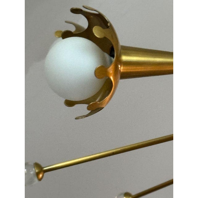Jonathan Adler Small Brass Sputnik Chandelier A modern riff on a mid century design. Custom laser-cut cups crown each bulb...