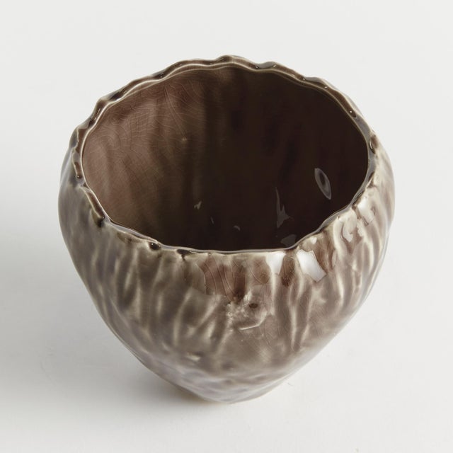 In an artisanmade slip cast design, this intricate natureinspired pot is a real treasure. The inherently beautiful glaze...
