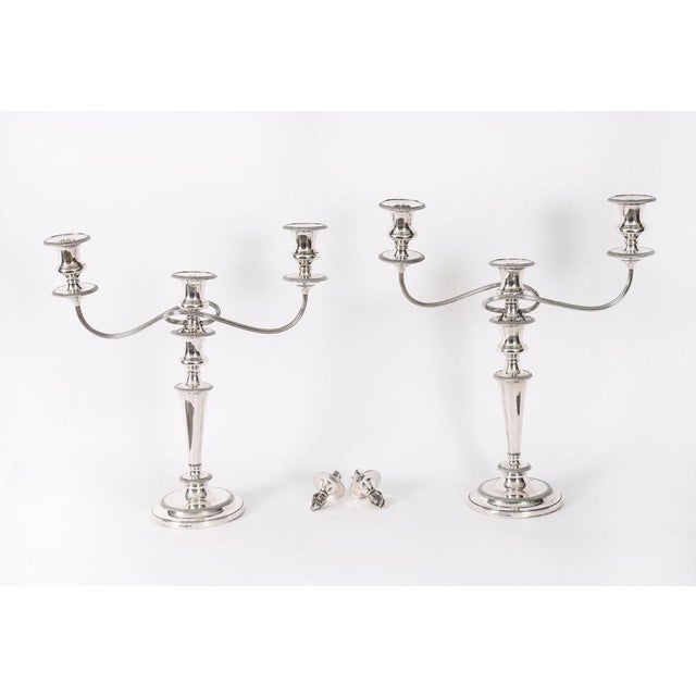 This is an elegant pair of antique Victorian silver-plated table candelabra, circa 1880 in date, and bearing the makers...