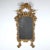 Fine, beautifully aged, original giltwood mirror with original mirror plate in the Rococo style with flowing symmetrical...