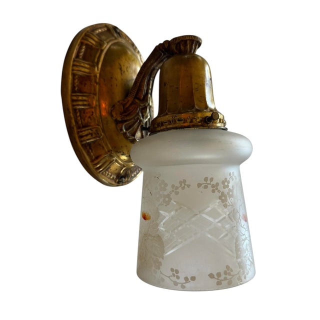 This pair of antique wall sconces will look great in any room of the house. Iridized wheel cut frosted glass on original...
