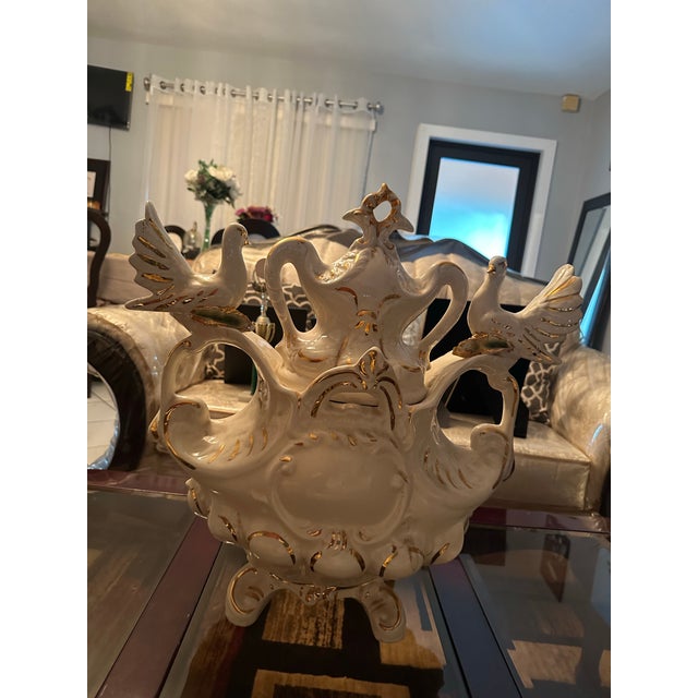 Ornate vintage porcelain centerpiece featuring swans/doves, sculpted roses, and rich gold detailing. Beautiful Hollywood...