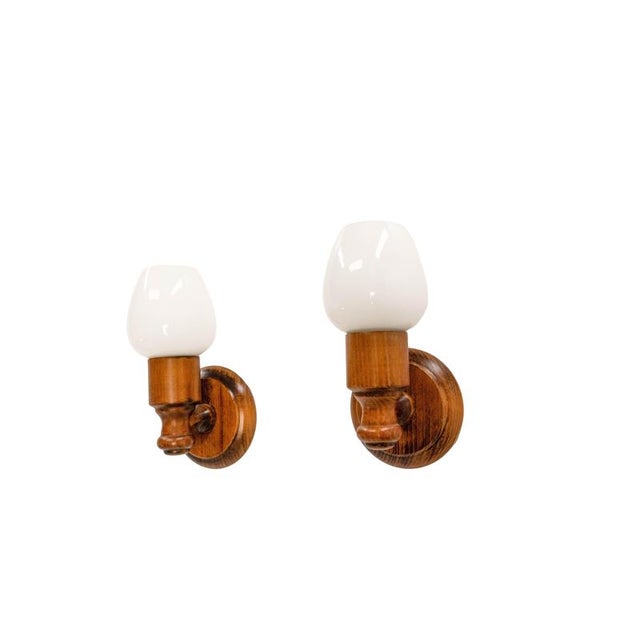 Midcentury pair of wall lights french made circa 1970. Beech and opaline glass. These are suitable to usa and eu or uk...