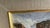 A charming mid-20th-century Dutch decorative oil painting depicting a snow-covered village along a frozen canal, with...