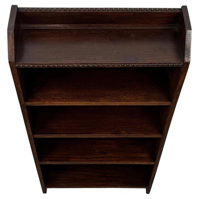 A charming early 20th-century English open bookcase, finely crafted from oak and distinguished by its unusually compact...
