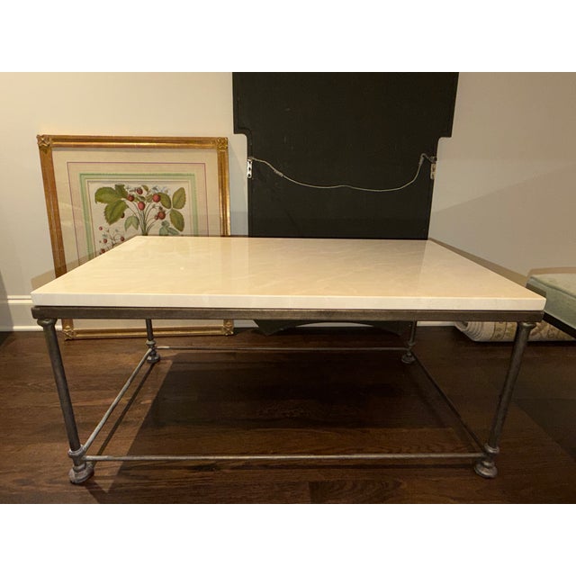 Salvations – Custom Dorset Cocktail Table - Iron base in Statuary Bronze with polished Crema Marfil stone top. Dimensions...